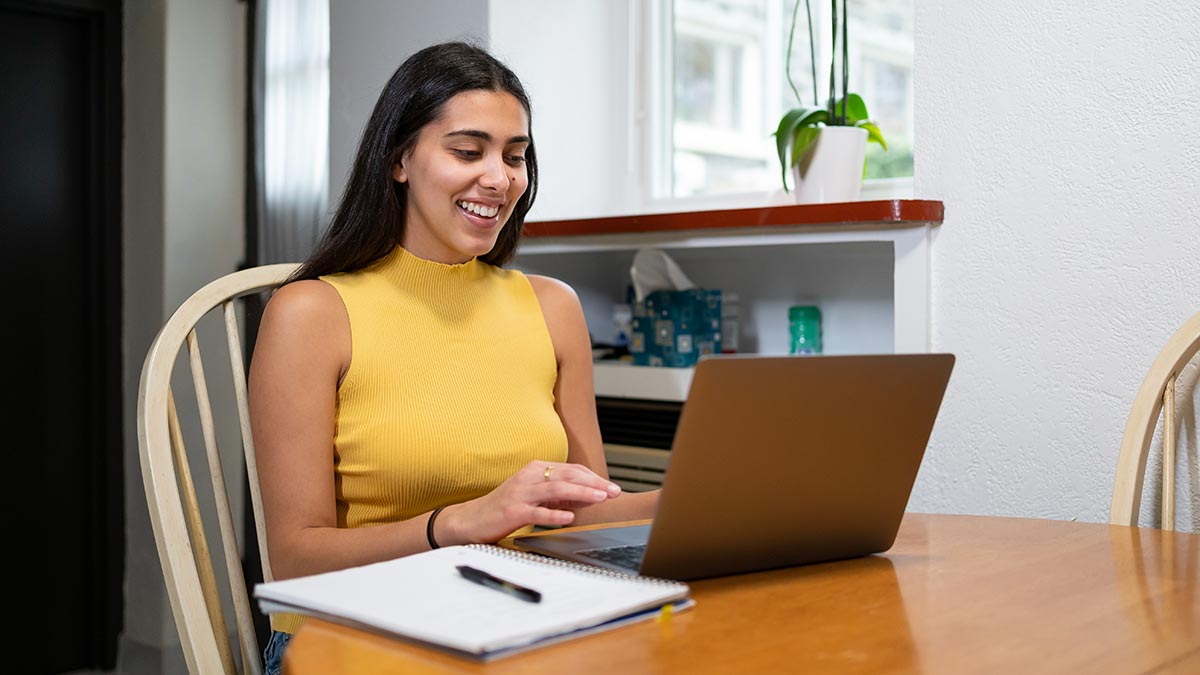 woman on laptop smiling
