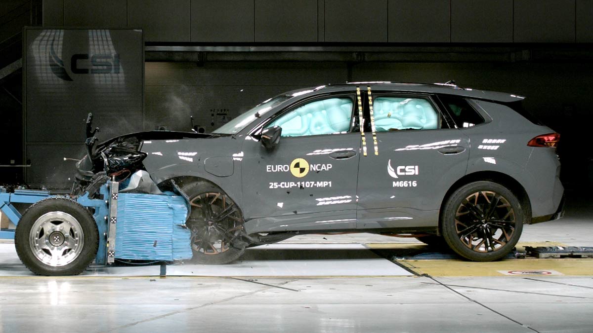 Grey Cupra Terramar SUV crashing into blue deformable barrier in frontal offset Euro NCAP test.