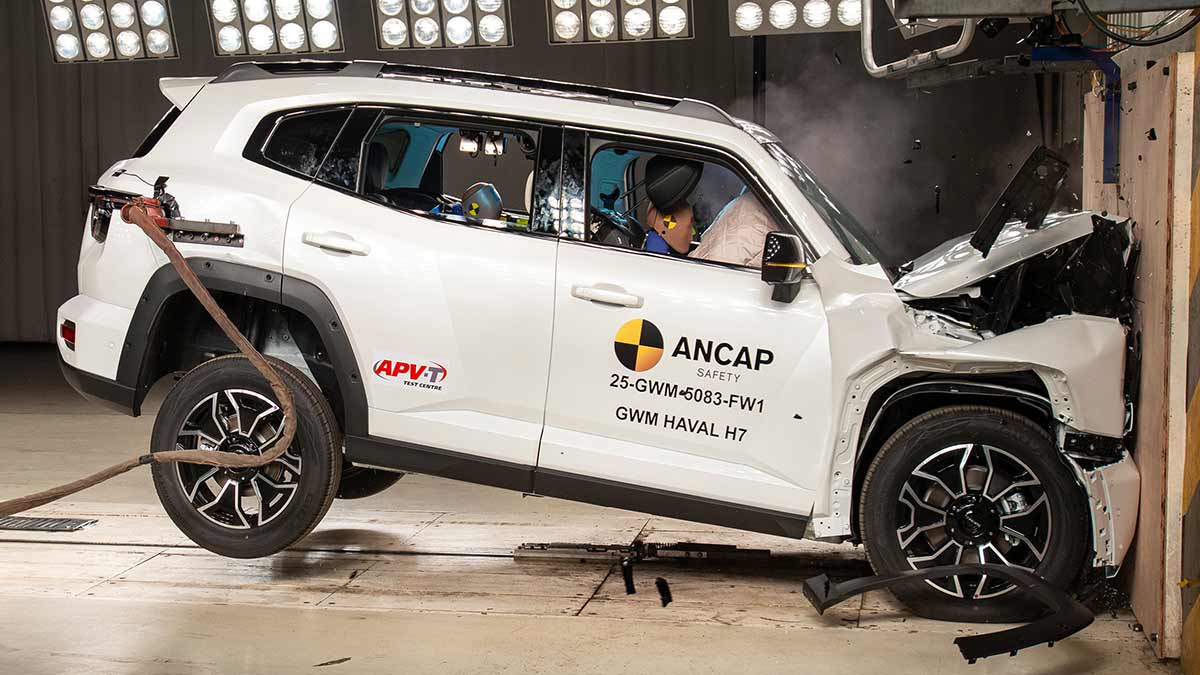 White GWM Haval H7 crashing into wall head-on at 50km/h with driver’s headrest coming detached in ANCAP test.