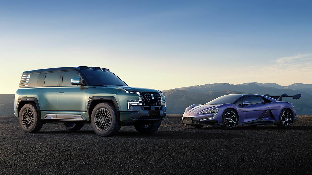 Green Yangwang U8 super-luxury SUV and purple Yangwang U9 supercar in remote mountainous location.