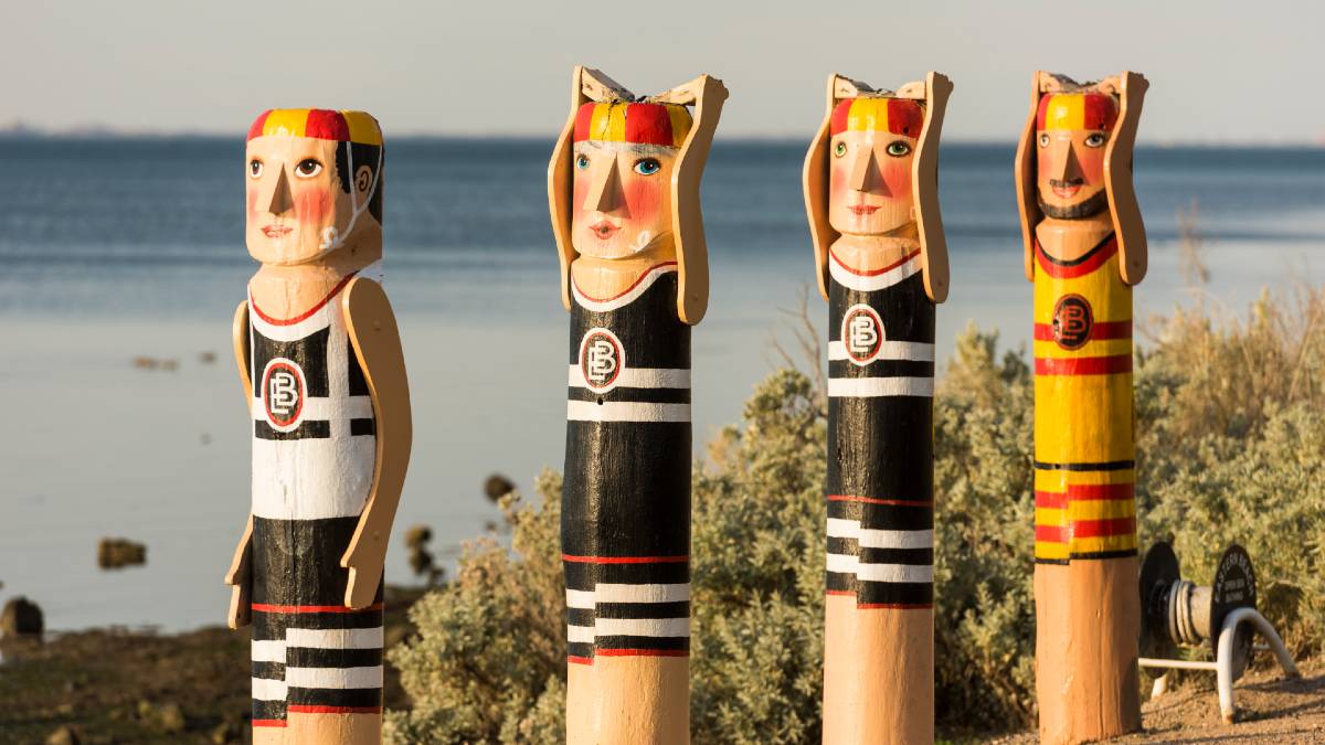 four colourful character bollards