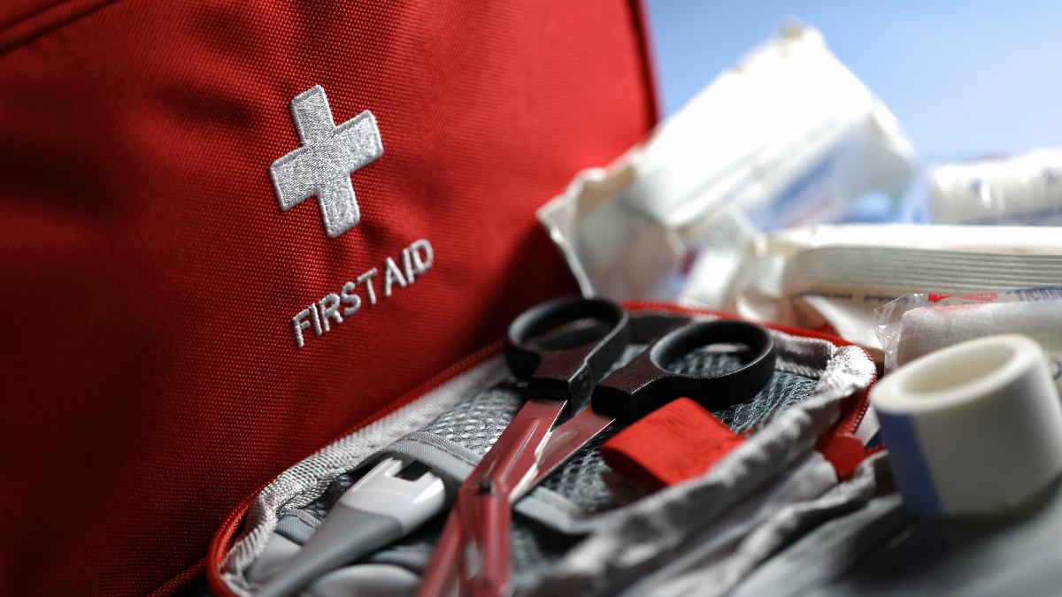 first aid kit with supplies displayed