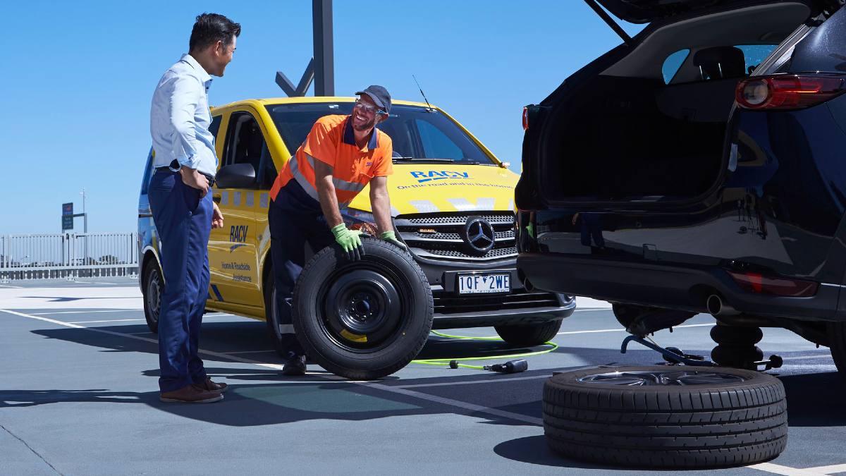 RACV ERA worker changing a tyre on a customer's car