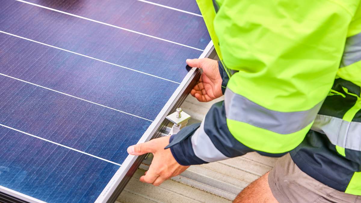 RACV Solar technician installing a solar panel on an Ocean Grove house