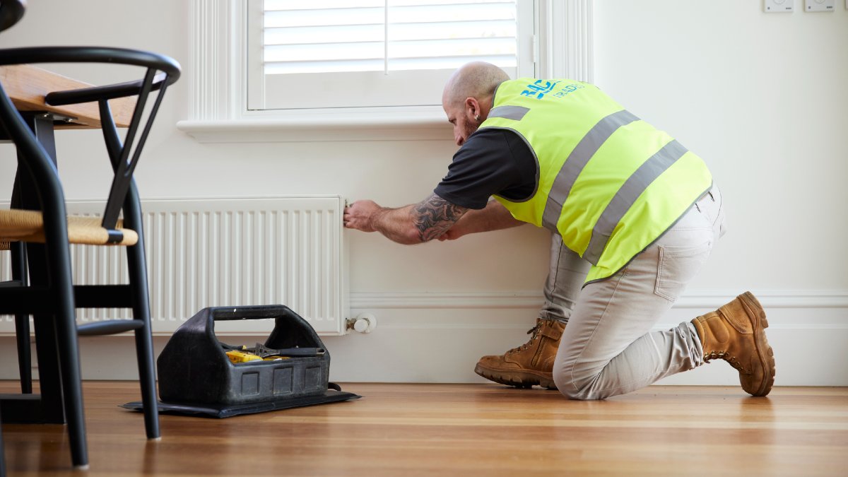 RACV tradie checking hydronic heater