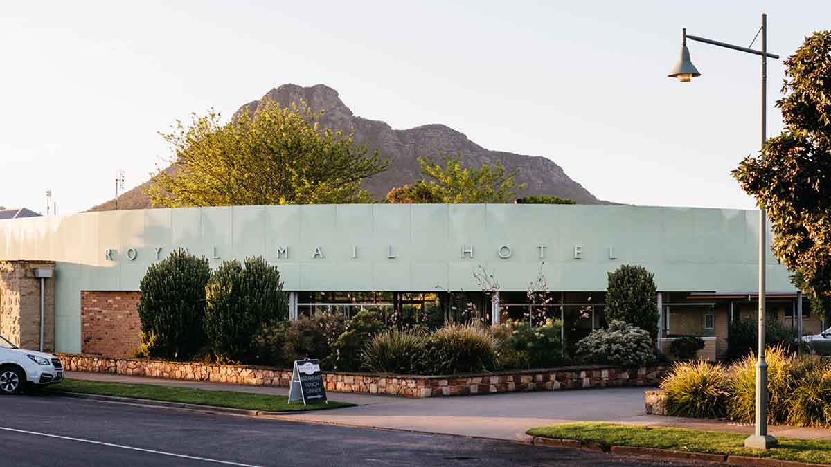 exterior of Royal Mail Hotel with mountain in background