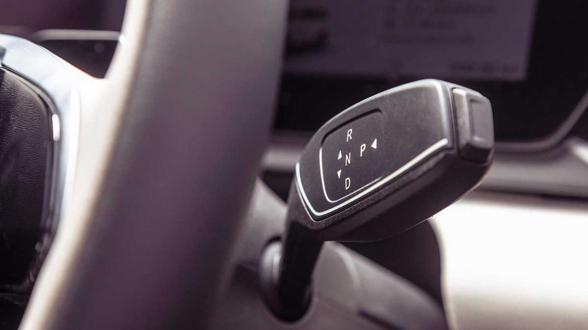 Detail shot of transmission lever stalk on steering column of Jaecoo J5 electric SUV.