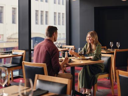 Couple enjoying a meal together at Charcoal restaurant