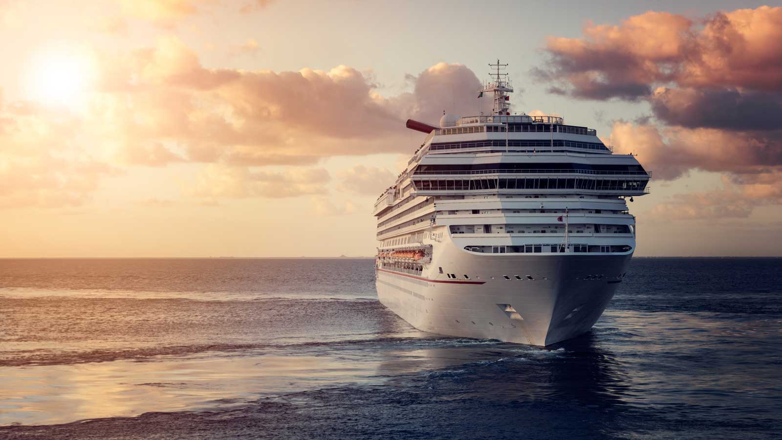 A crise ship in the ocean at dusk time.