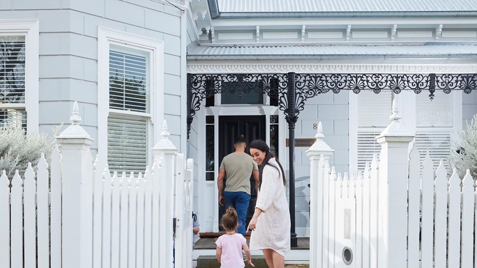 A family walking into their home