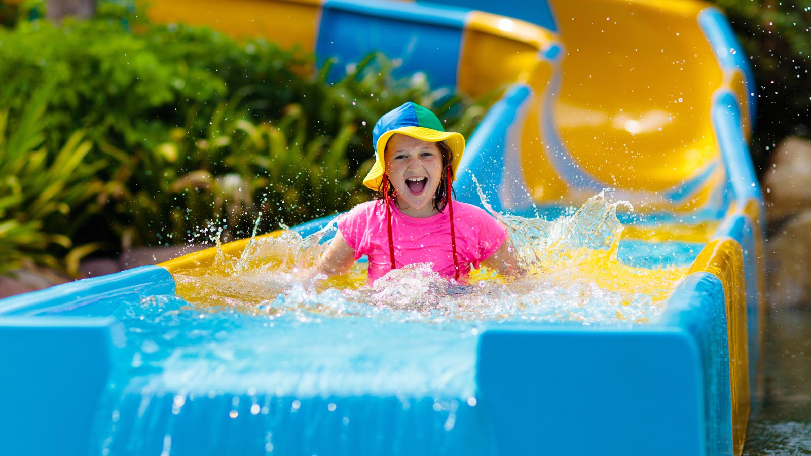 Girl going down a water slide