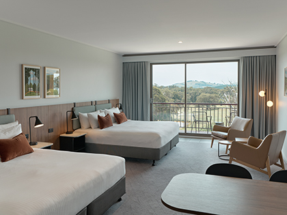 Fairway room at RACV Goldfields Resort, featuring two king beds, couches and tables.