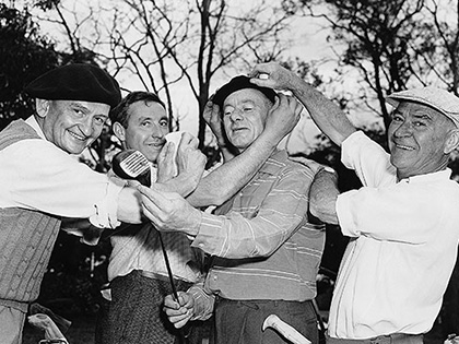 Four men dressed in golf attire smiling towards the camera at the RACV Golf Tournament 1959.