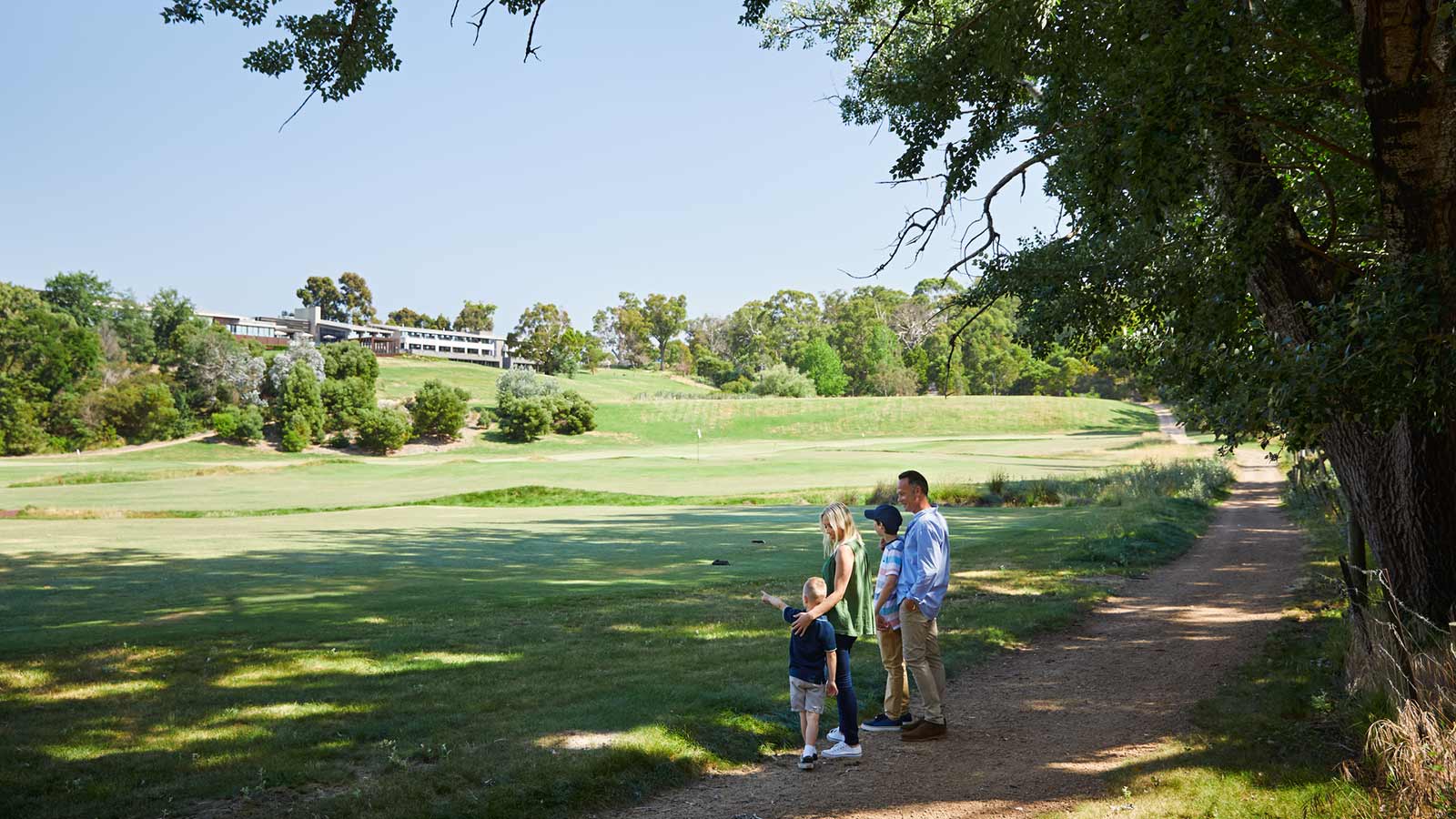 Family taking a walk on RACV Healesville Country Club & Resort grounds.