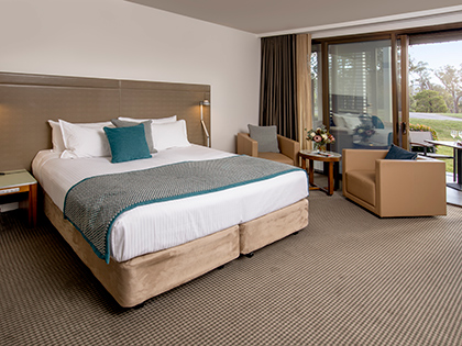 Golf View Room at RACV Healesville Country Club and Resort, featuring a king bed, couches and balcony.