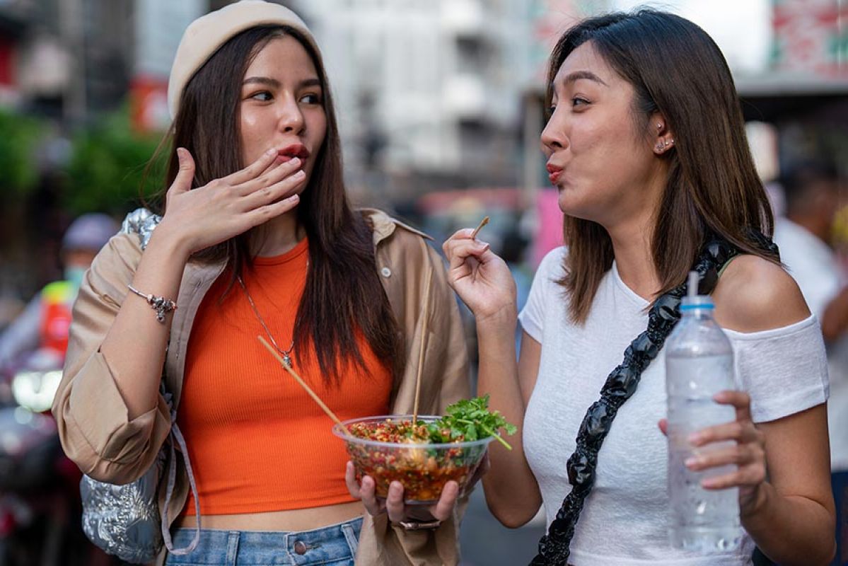 aerial view of Lisbon with castle on hill, river and many buildings