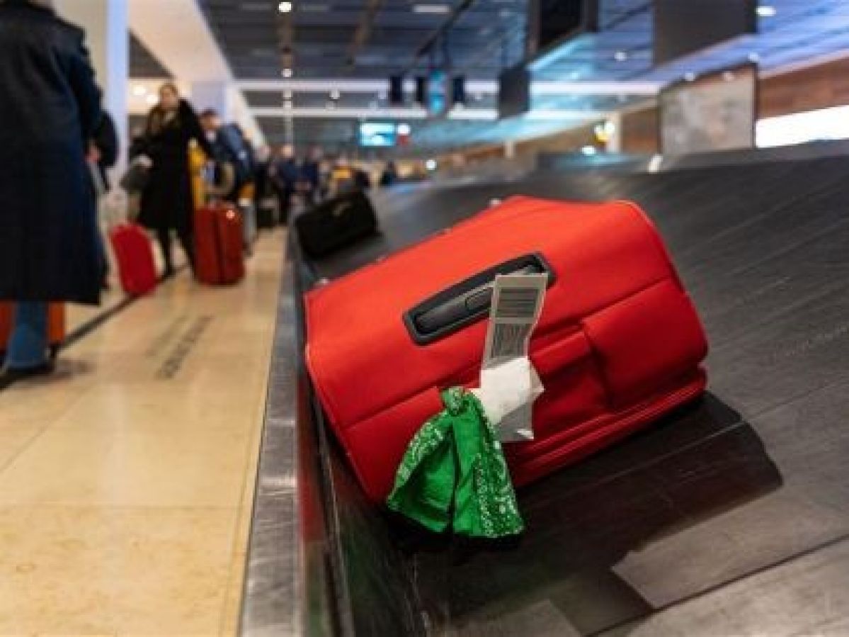 Luggage on airport carousel.