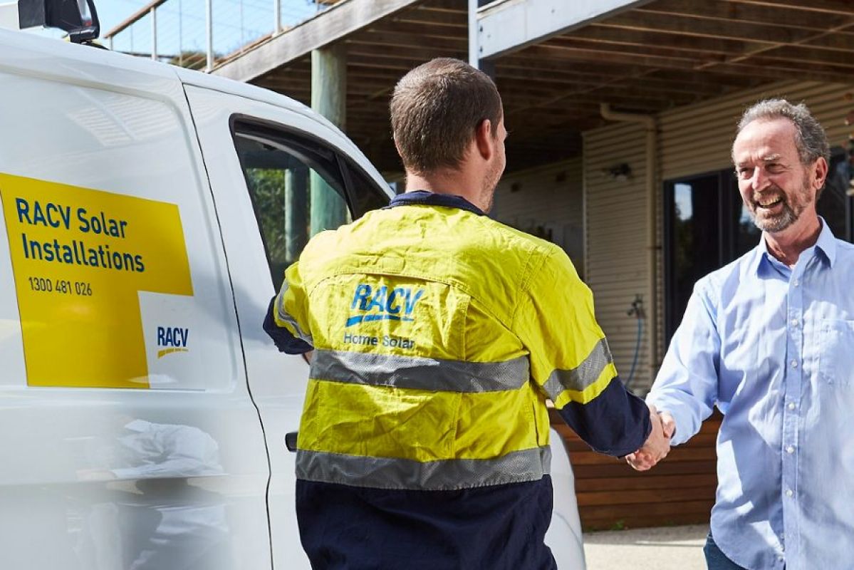 RACV solar technician shaking hands with a homeowner