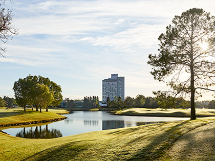 RACV Royal Pines Resort near a lake.