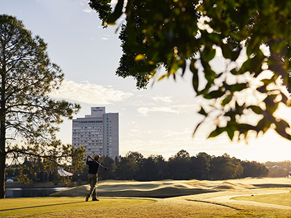 Man playing golf at RACV's Royal Pines golf course.