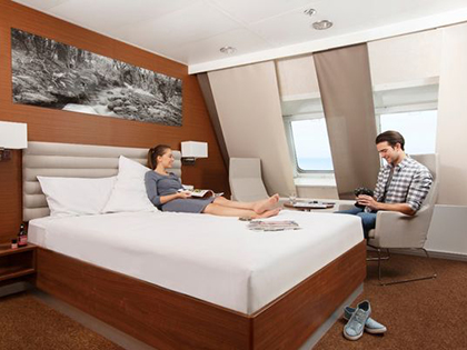 Two people in their bedroom on the Spirit of Tasmania.